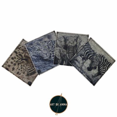 Set of four eco-friendly felt coasters featuring wildlife-inspired prints: Lazy Days - a leopard in a tree, Jungle Cat - a close-up leopard portrait, A Conversation - two zebras fighting, and Family - three elephants