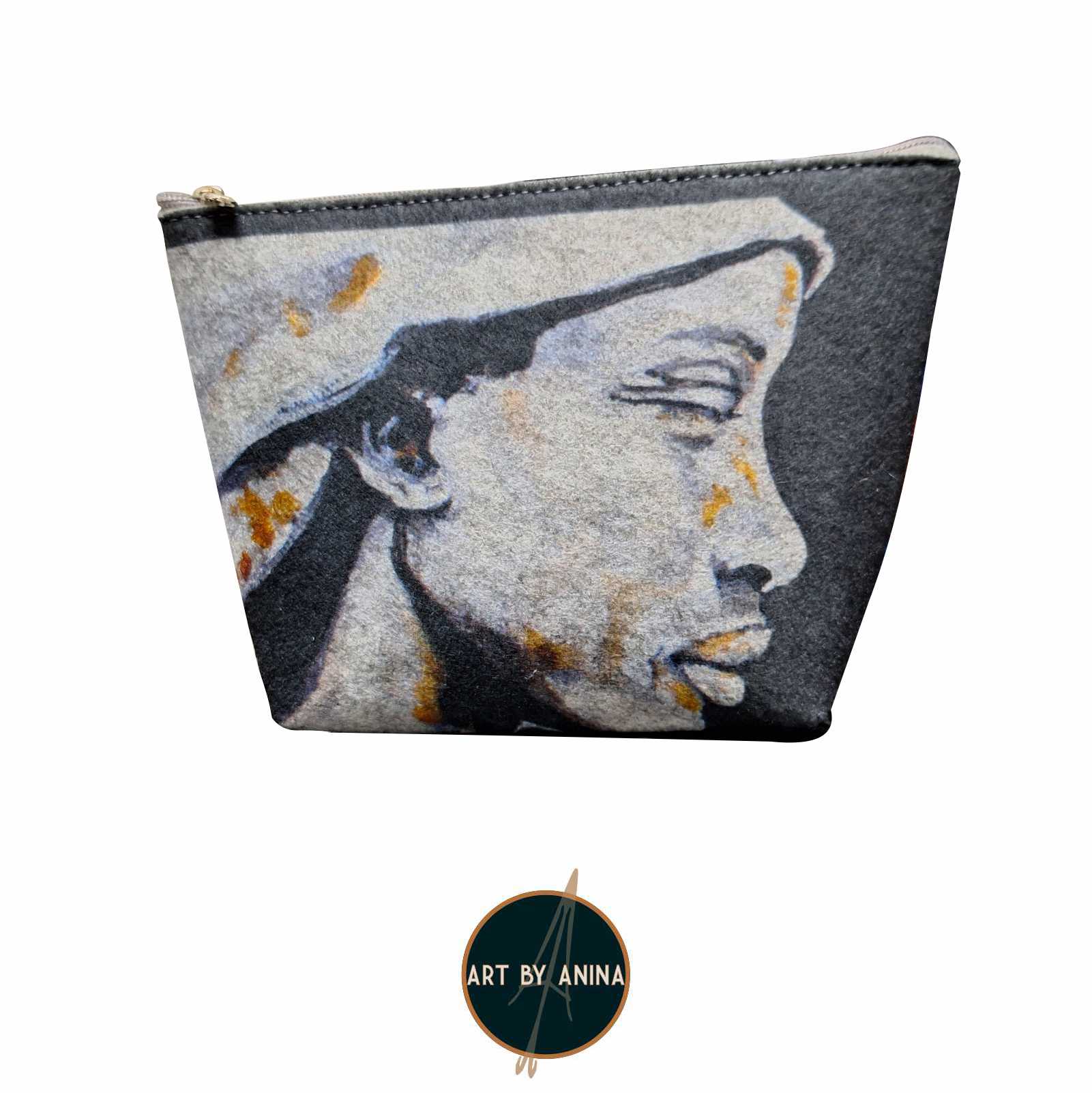 Product photo of a sustainable recycled felt cosmetic bag featuring an african monochrome portrait